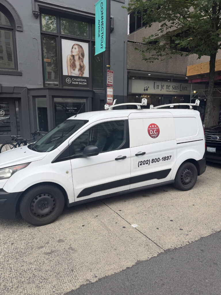Mobile locksmith van for The Locksmith DC Company on a Washington DC street.